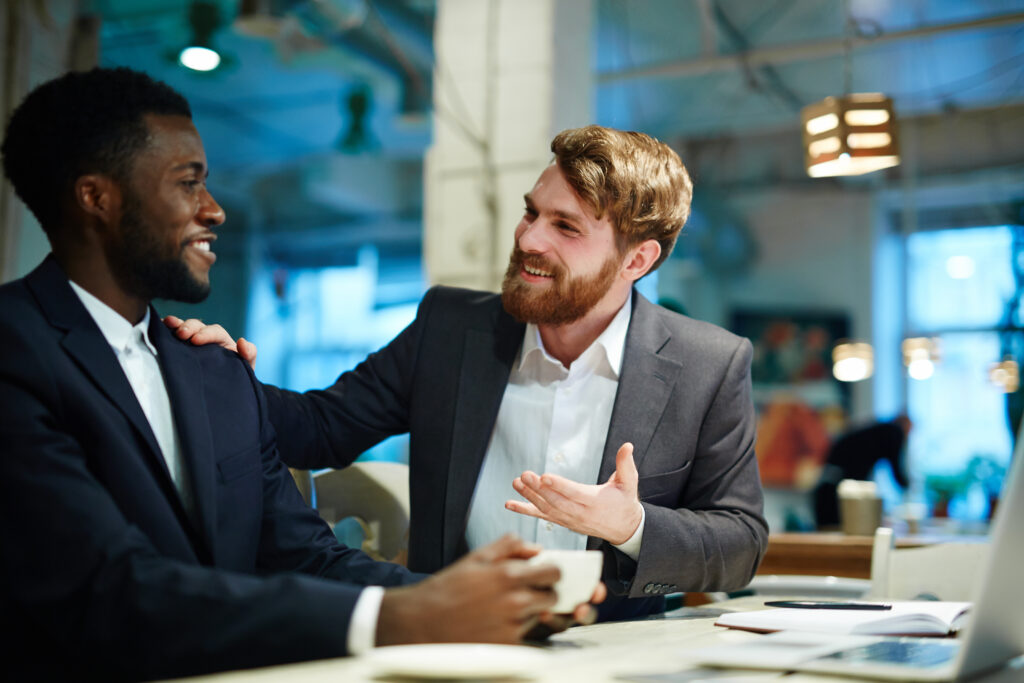 Two people talking during a business mentorship program